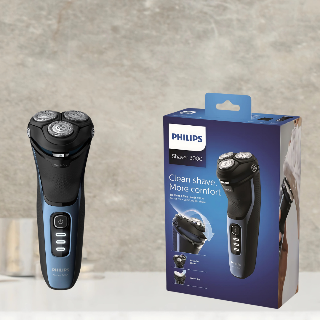 Philips S3232 electric shaver in hand, highlighting ergonomic design