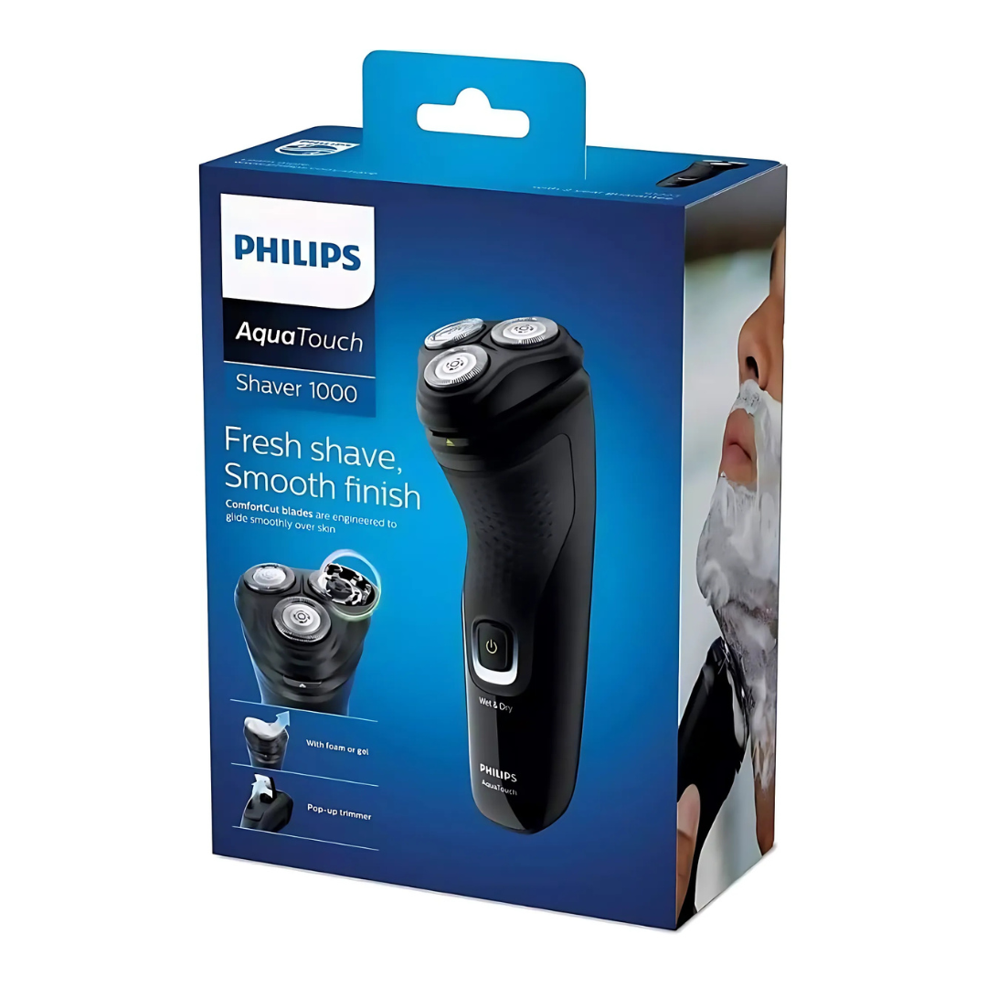 Philips S1223 electric shaver in hand, highlighting ergonomic design"