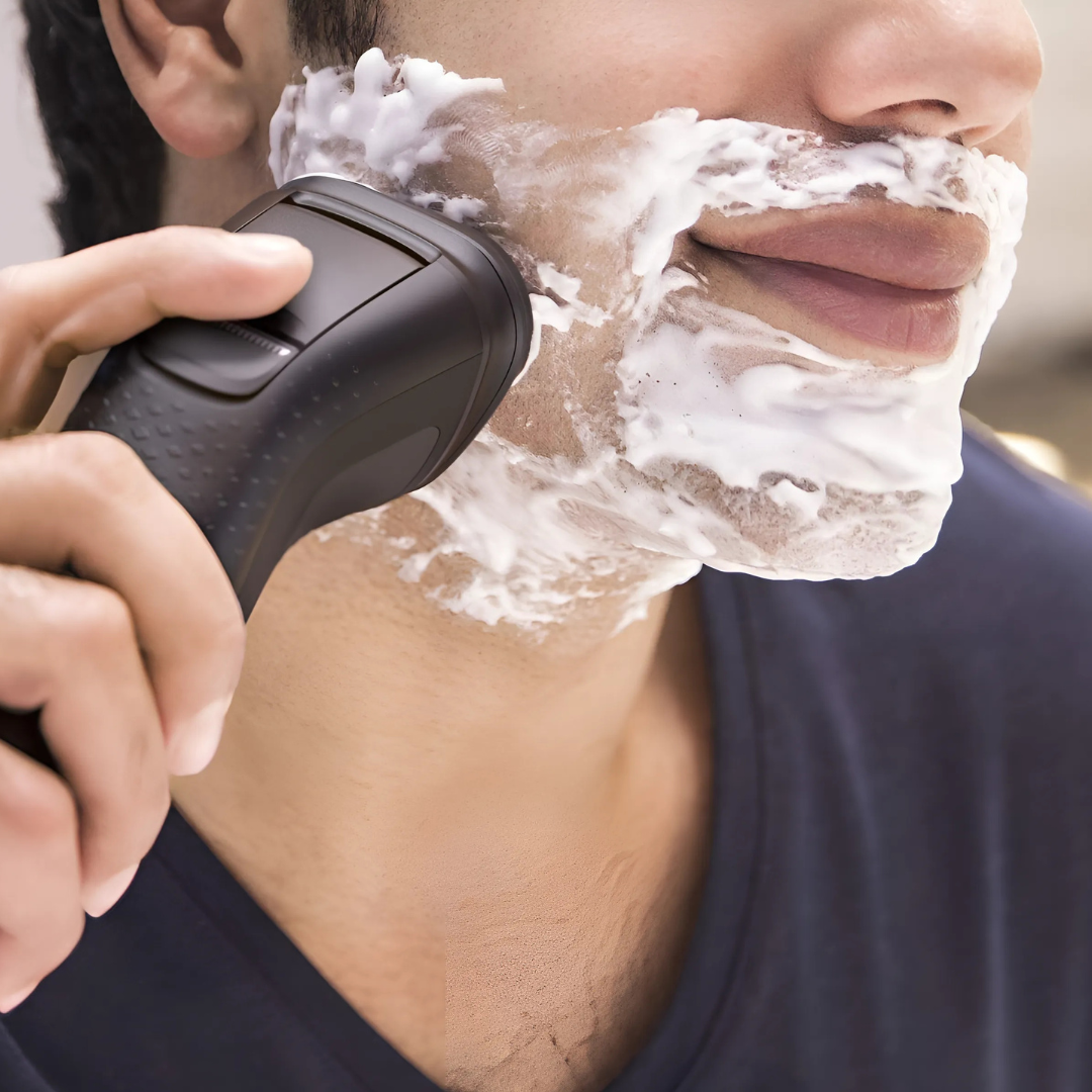 Philips S1223 electric shaver in hand, highlighting ergonomic design"